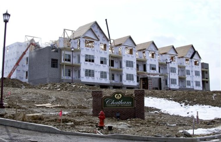 Construction continues on a row of condominiums in Cranberry, Pa. Sales of new homes fell to the lowest level on record in February.